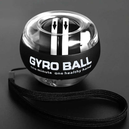 Self-starting wrist gyro ball power trainer for forearm and finger muscle strengthening