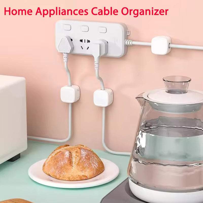 Magnetic cable clip holding multiple cords neatly on a wooden desk for organized cable management